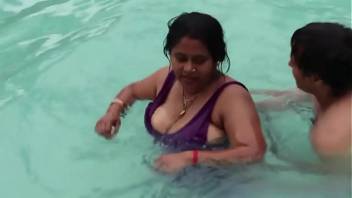 Hot sexy desi aunty showing assets in the pool